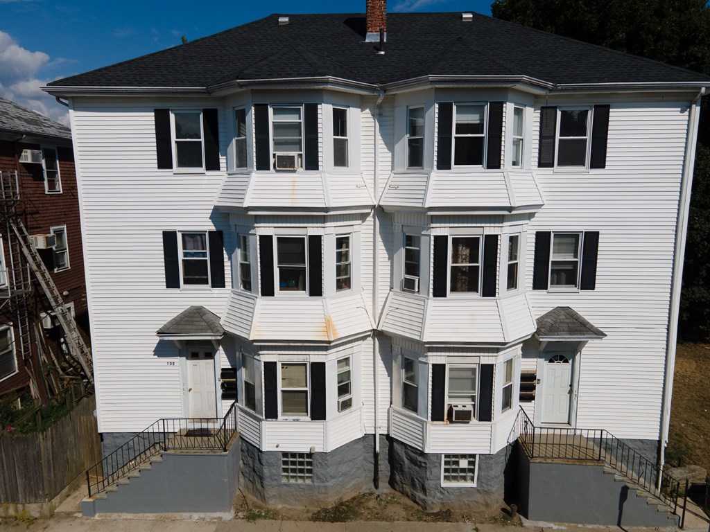 130 Baker Street Fall River, MA 02721 - Photo 5 of 21 a front view of residential houses with street