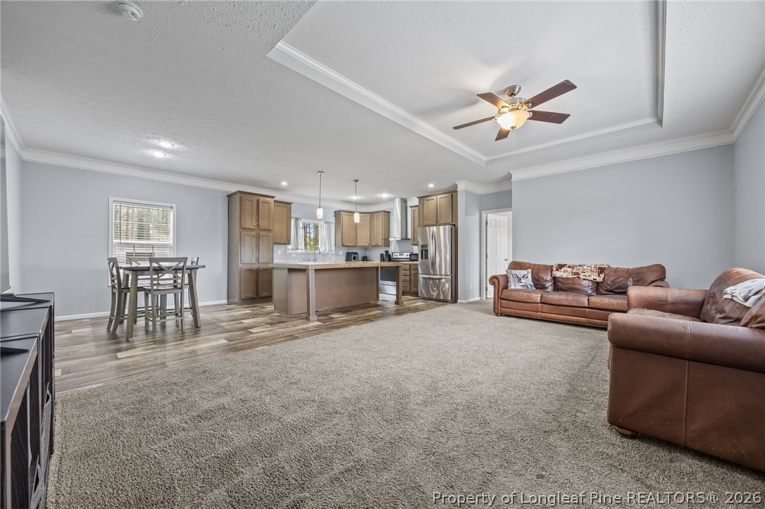 2252 Old Stage Road South Erwin, NC 28339 - Photo 23 of 47 a living room with furniture and a dining table with kitchen view