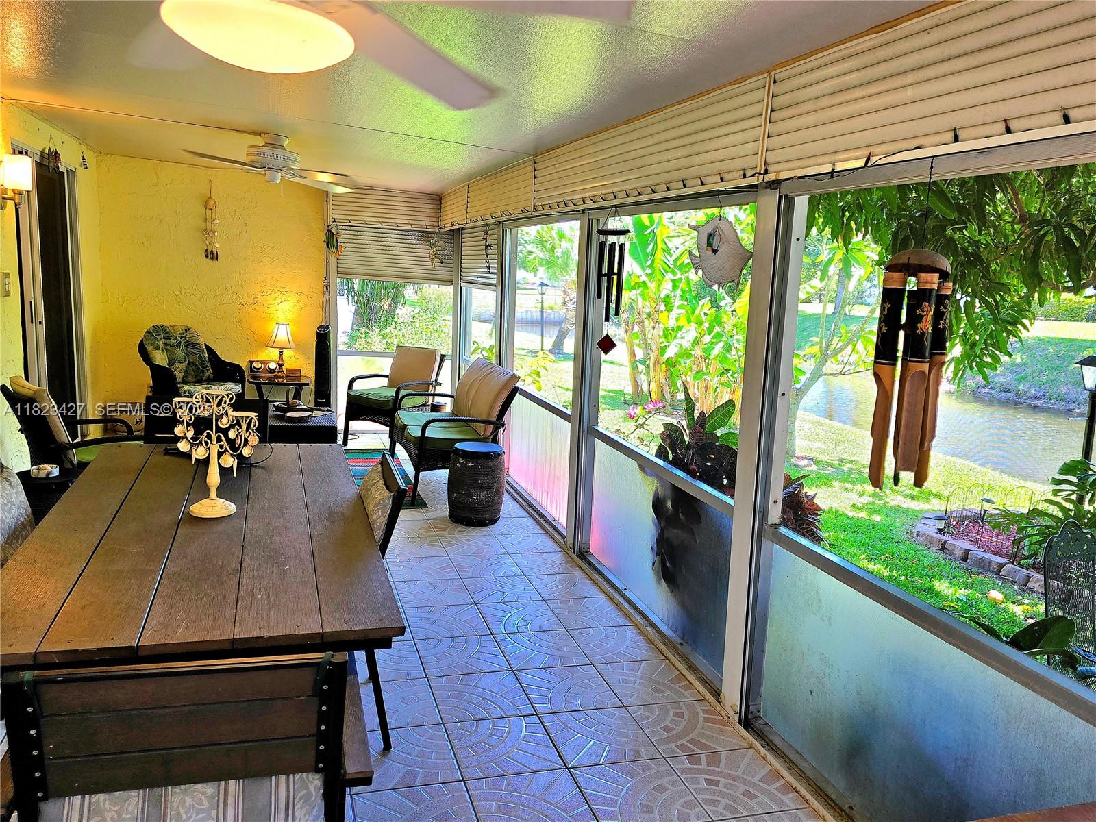 1711 Southwest 22nd Street Boynton Beach, FL 33426 - Photo 19 of 60 a outdoor dining space with furniture
