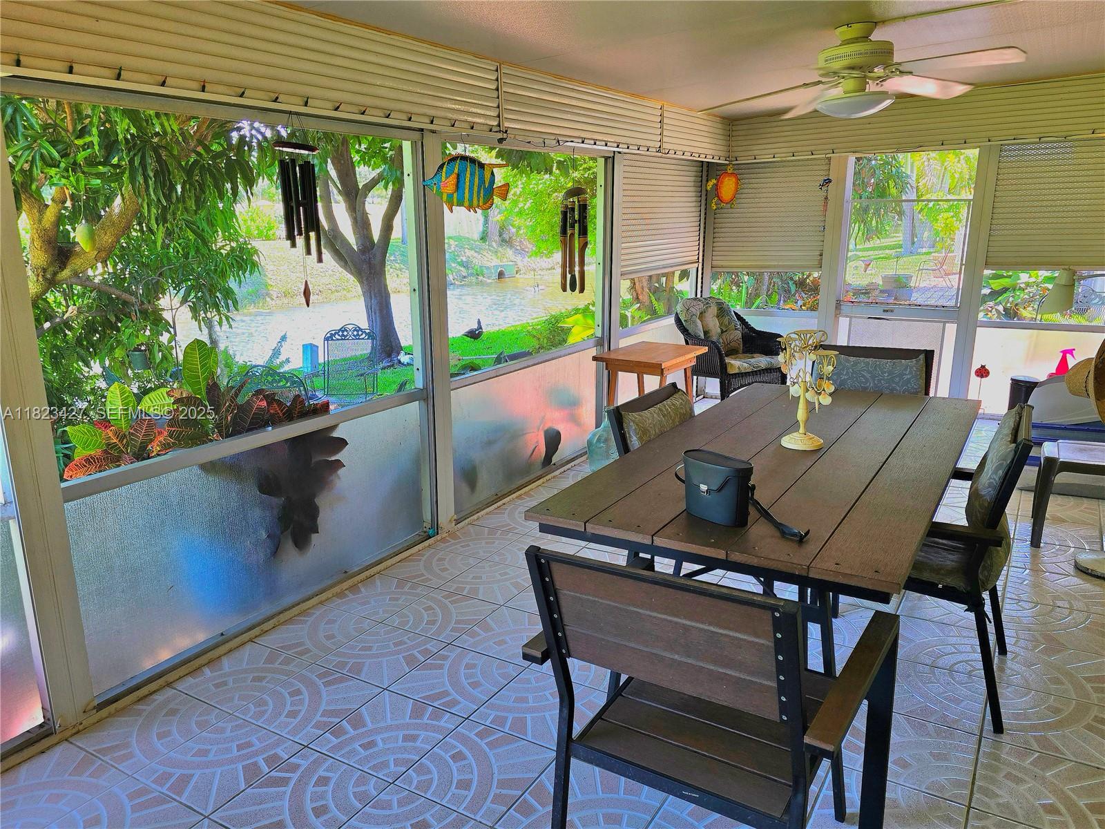 1711 Southwest 22nd Street Boynton Beach, FL 33426 - Photo 21 of 60 a view of an outdoor dining space with furniture