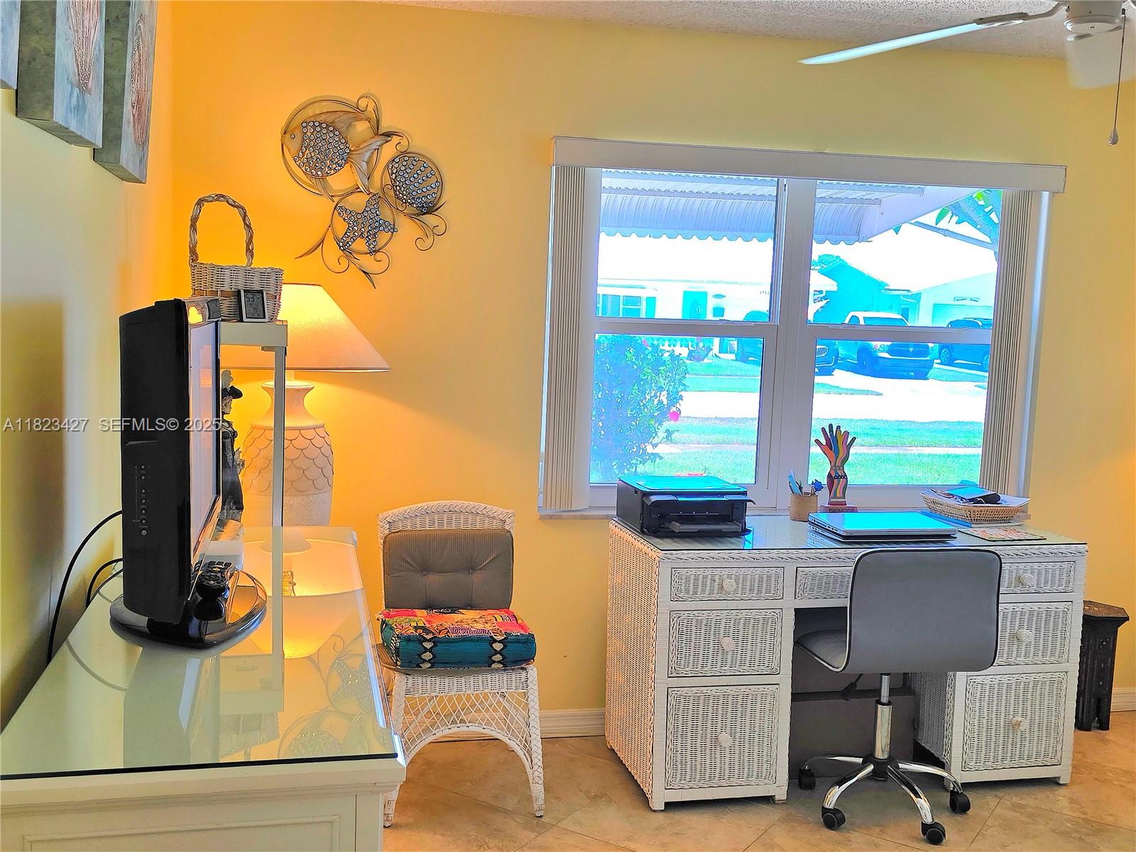 1711 Southwest 22nd Street Boynton Beach, FL 33426 - Photo 35 of 60 a view of a workspace with a window