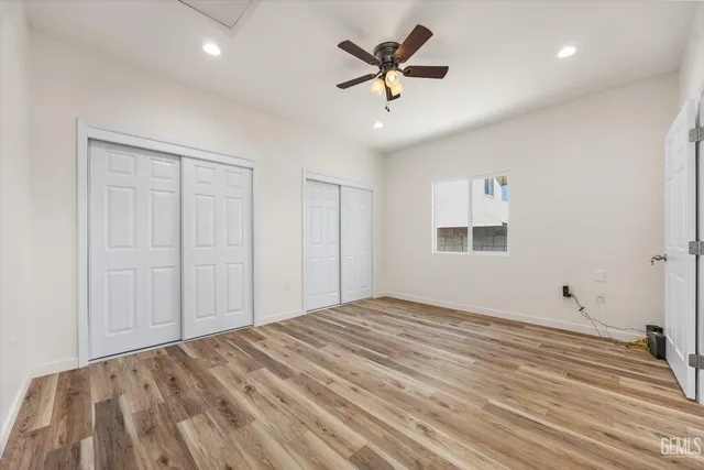 a bathroom with a sink toilet vanity and bathtub
