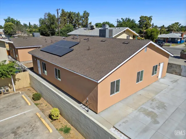 a kitchen with stainless steel appliances granite countertop white cabinets and a sink