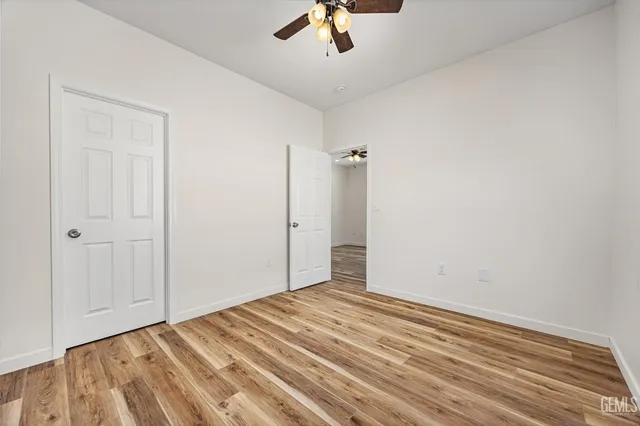 a view of a kitchen with wooden floor and a sink