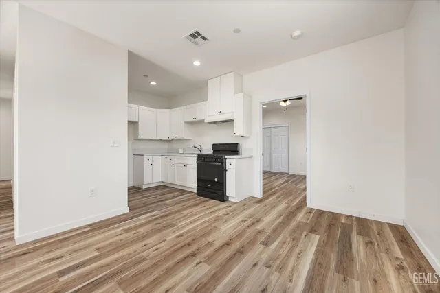 a view of a kitchen counter space and a sink