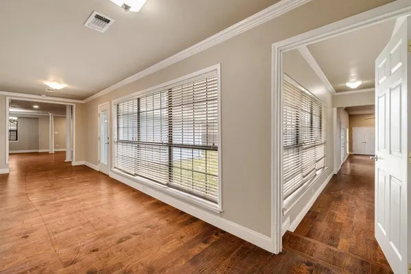 a view of a room with large windows