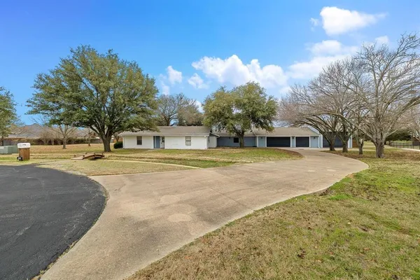 a house with trees in the background