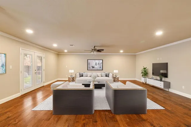 a living room with fireplace furniture and a flat screen tv