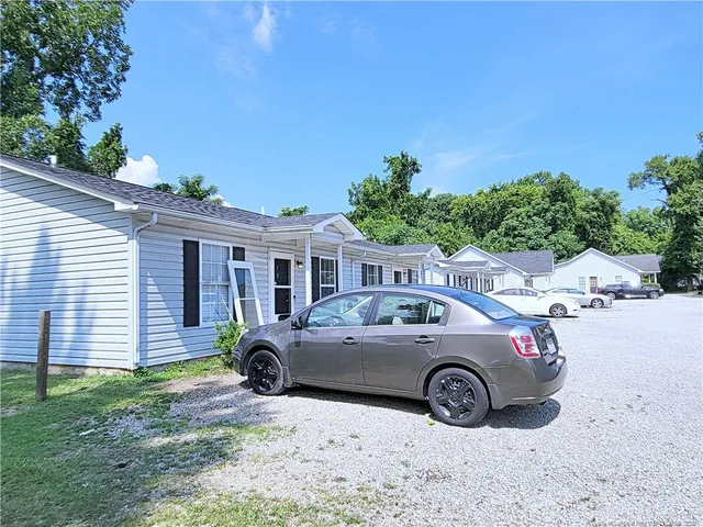 a view of a car parked in front of a house