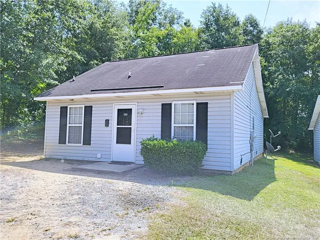a house view with a backyard space