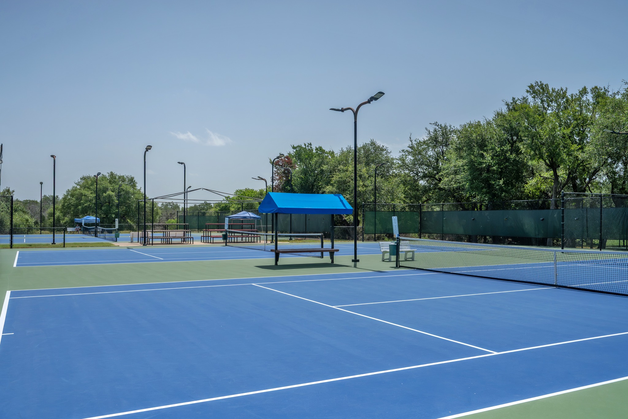30115 Sawgrass Trail Georgetown, TX 78628 - Photo 36 of 37 Sporting amenities include well-maintained tennis courts with ample lighting and spectator seating.