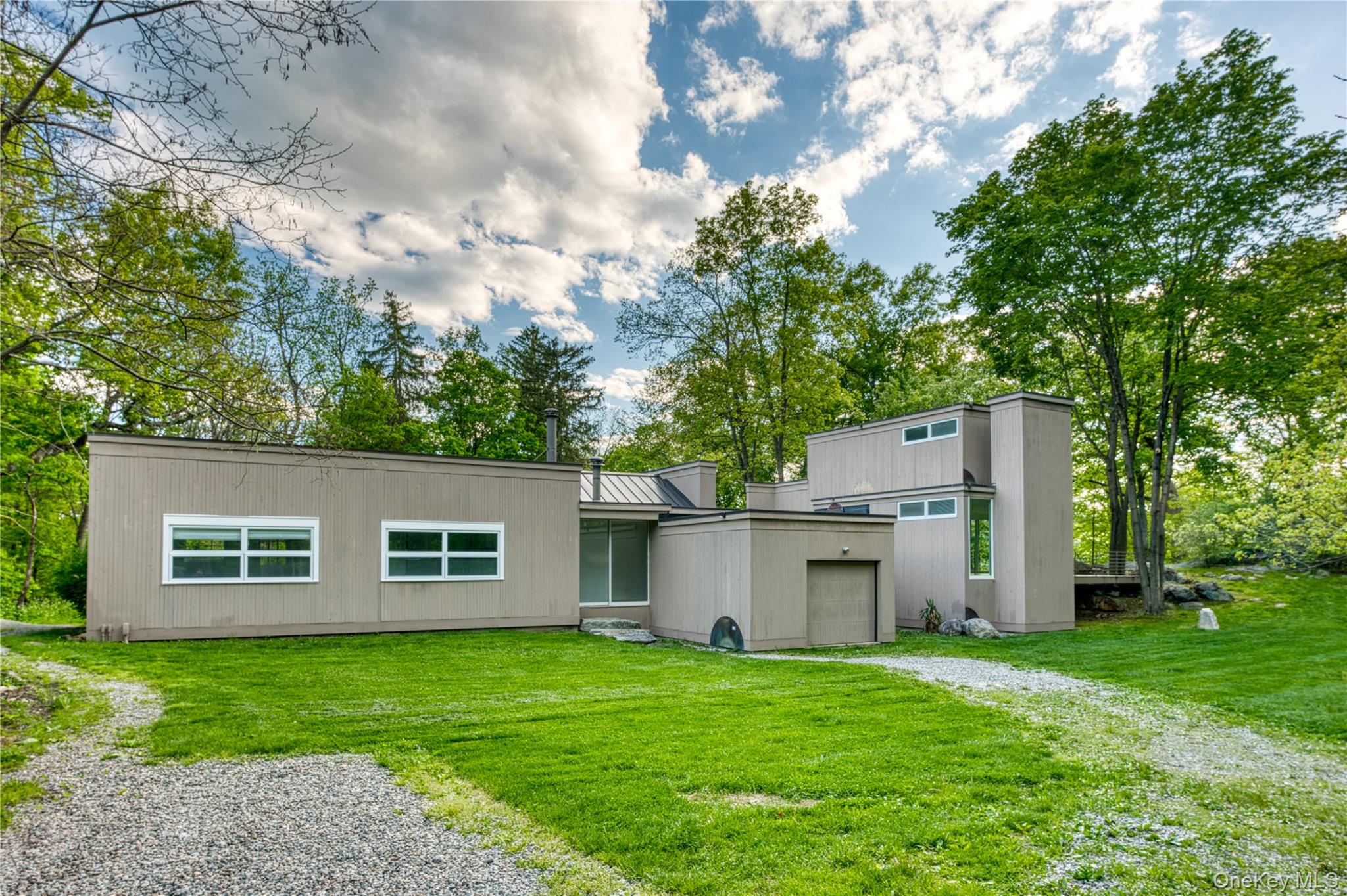 front view of a house with a yard