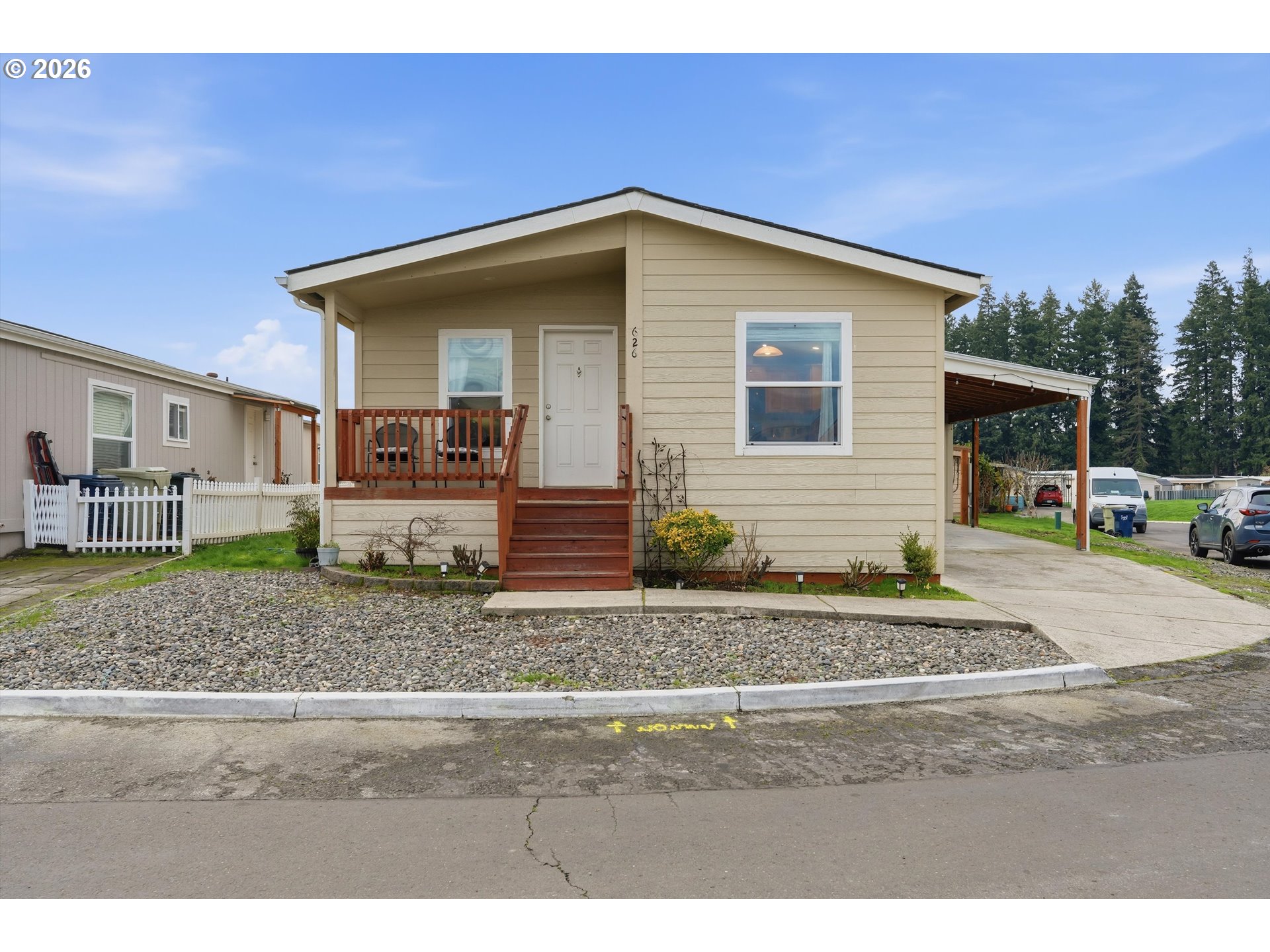 626 Southwest Philadelphia Way, Unit 176 Beaverton, OR 97006 - Photo 2 of 28 a view of a house with a yard