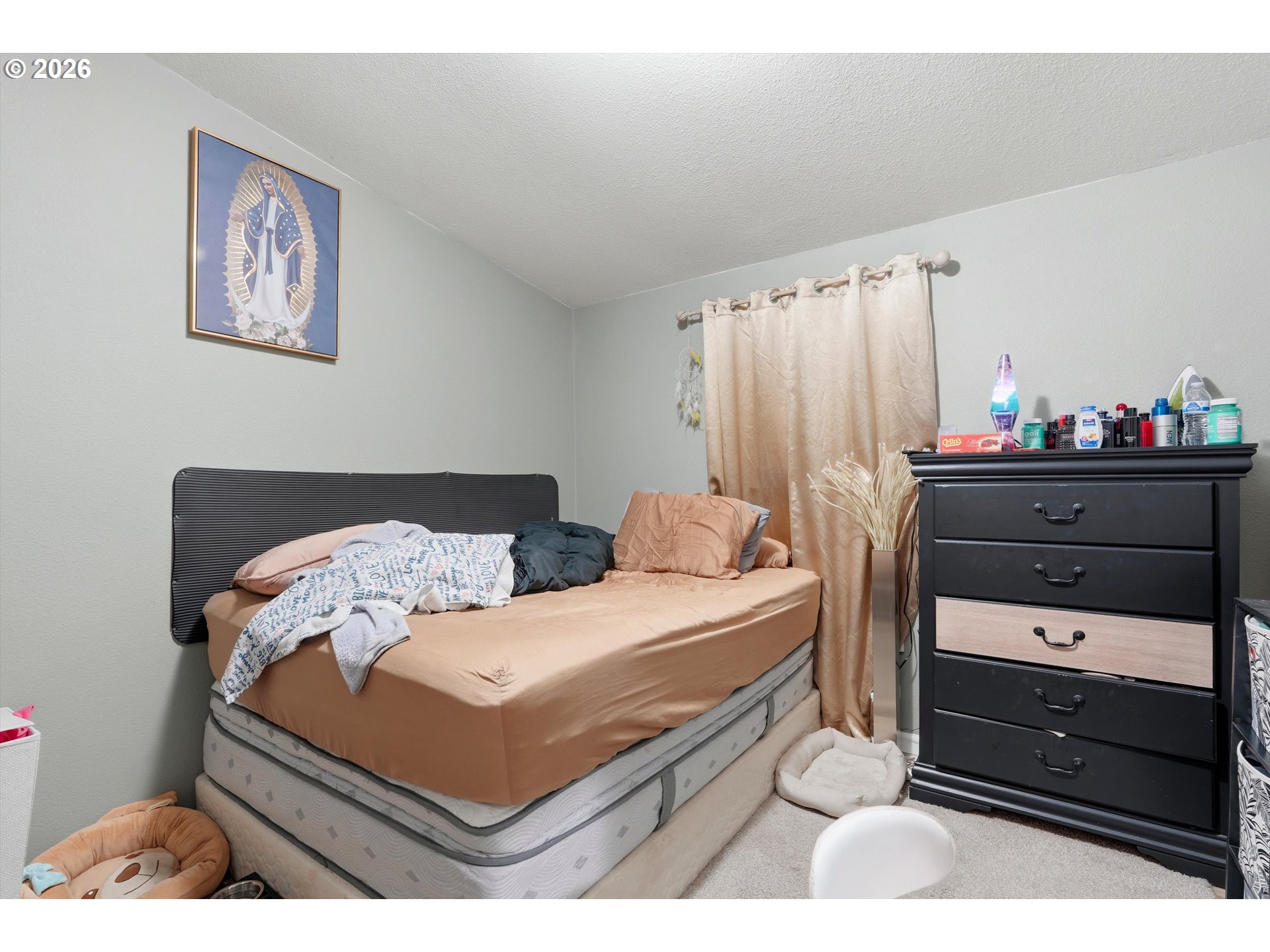 626 Southwest Philadelphia Way, Unit 176 Beaverton, OR 97006 - Photo 21 of 28 a bedroom with a bed and a dresser