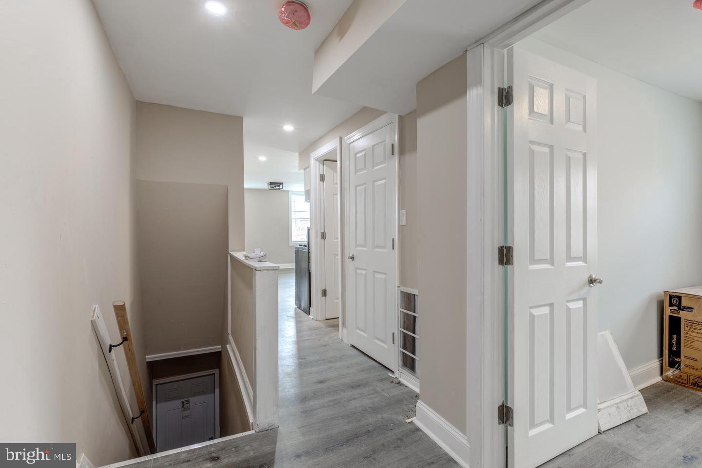 608 9th Street, Unit 2 Chester, PA 19013 - Photo 3 of 13 a view of a hallway with wooden floor and staircase