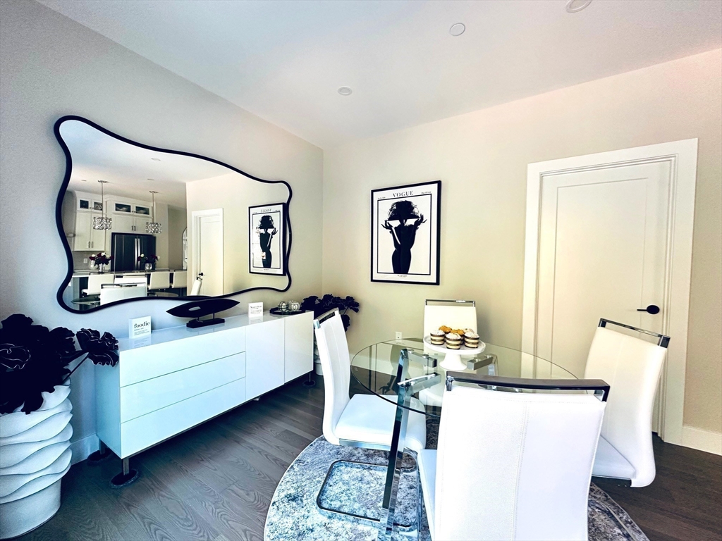 3 Elise Avenue, Unit 95 Londonderry, NH 03053 - Photo 12 of 42 a living room with furniture and a mirror