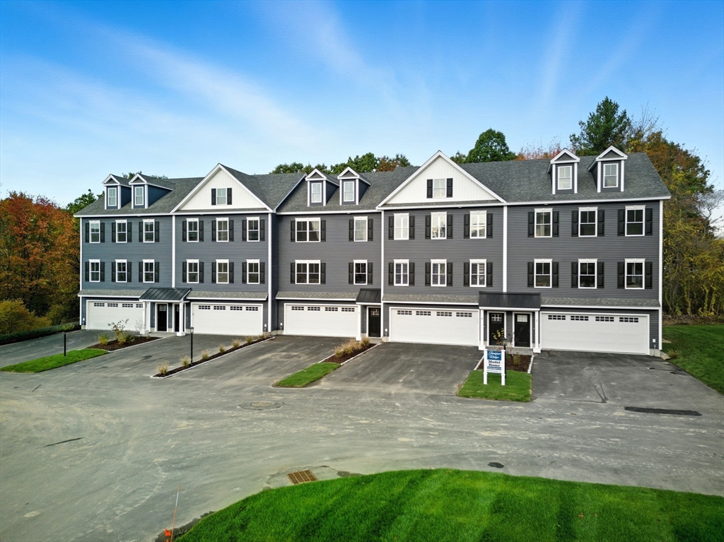 3 Elise Avenue, Unit 95 Londonderry, NH 03053 - Photo 20 of 42 a front view of a house with a yard