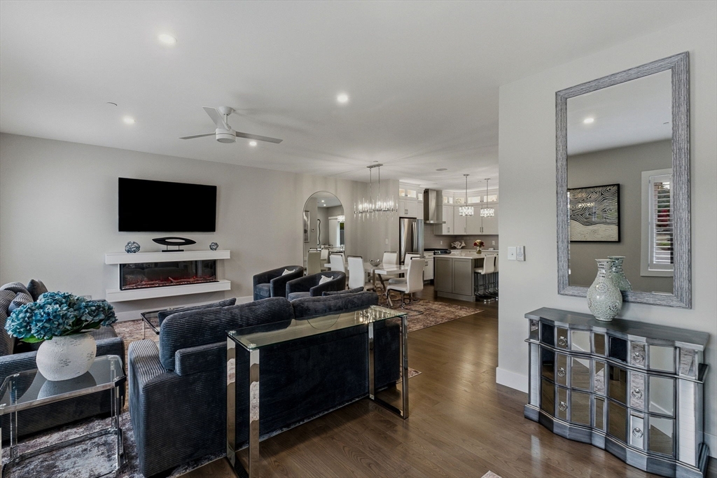 3 Elise Avenue, Unit 95 Londonderry, NH 03053 - Photo 29 of 42 a living room with furniture and a flat screen tv