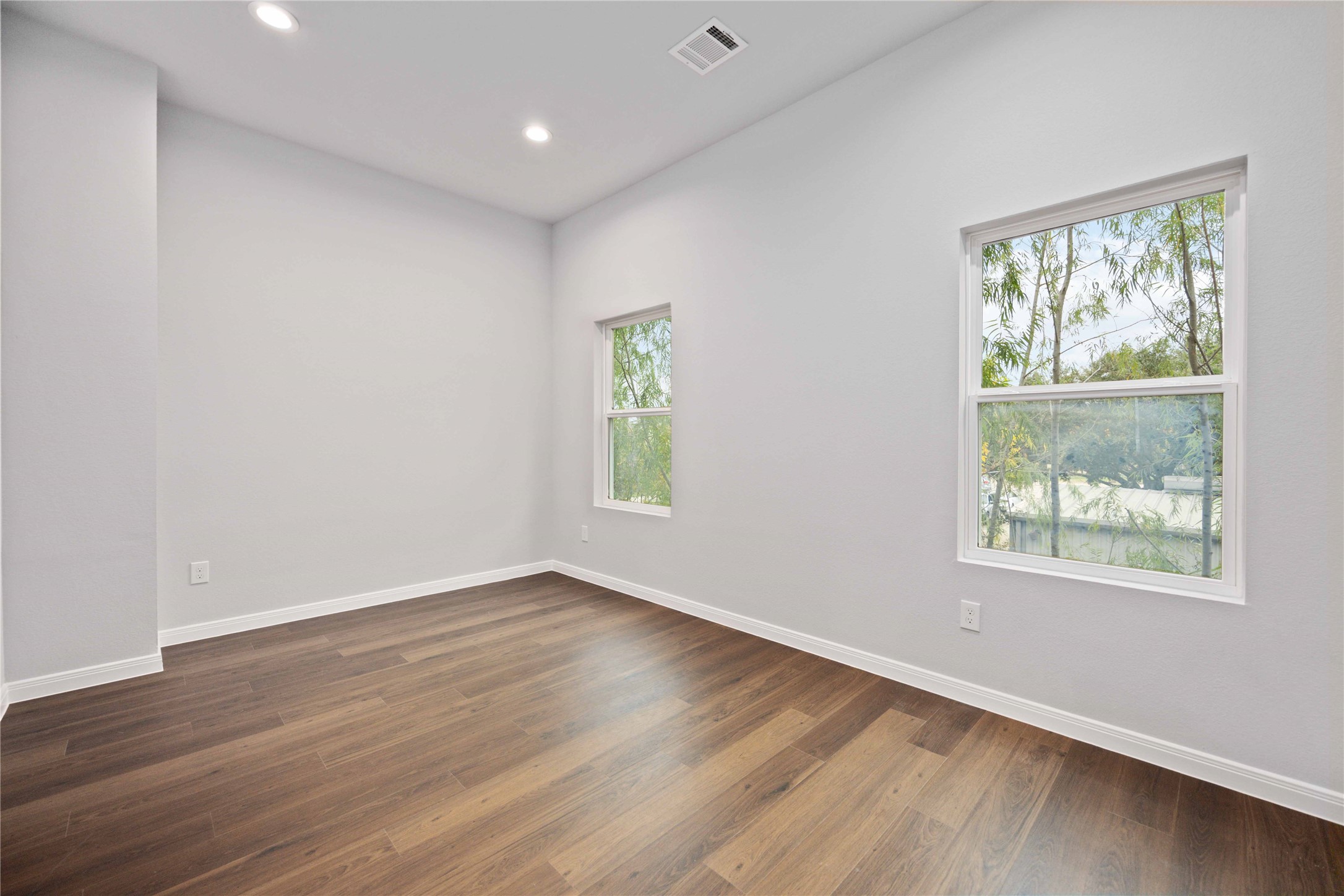 18831 Luminescent Ln Spring Spring, TX 77379 - Photo 34 of 36 a view of an empty room with wooden floor and a window