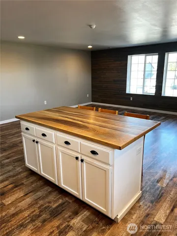 a view of an empty room with windows