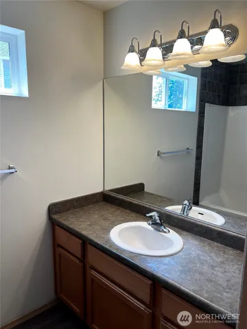 a bathroom with a sink and a mirror