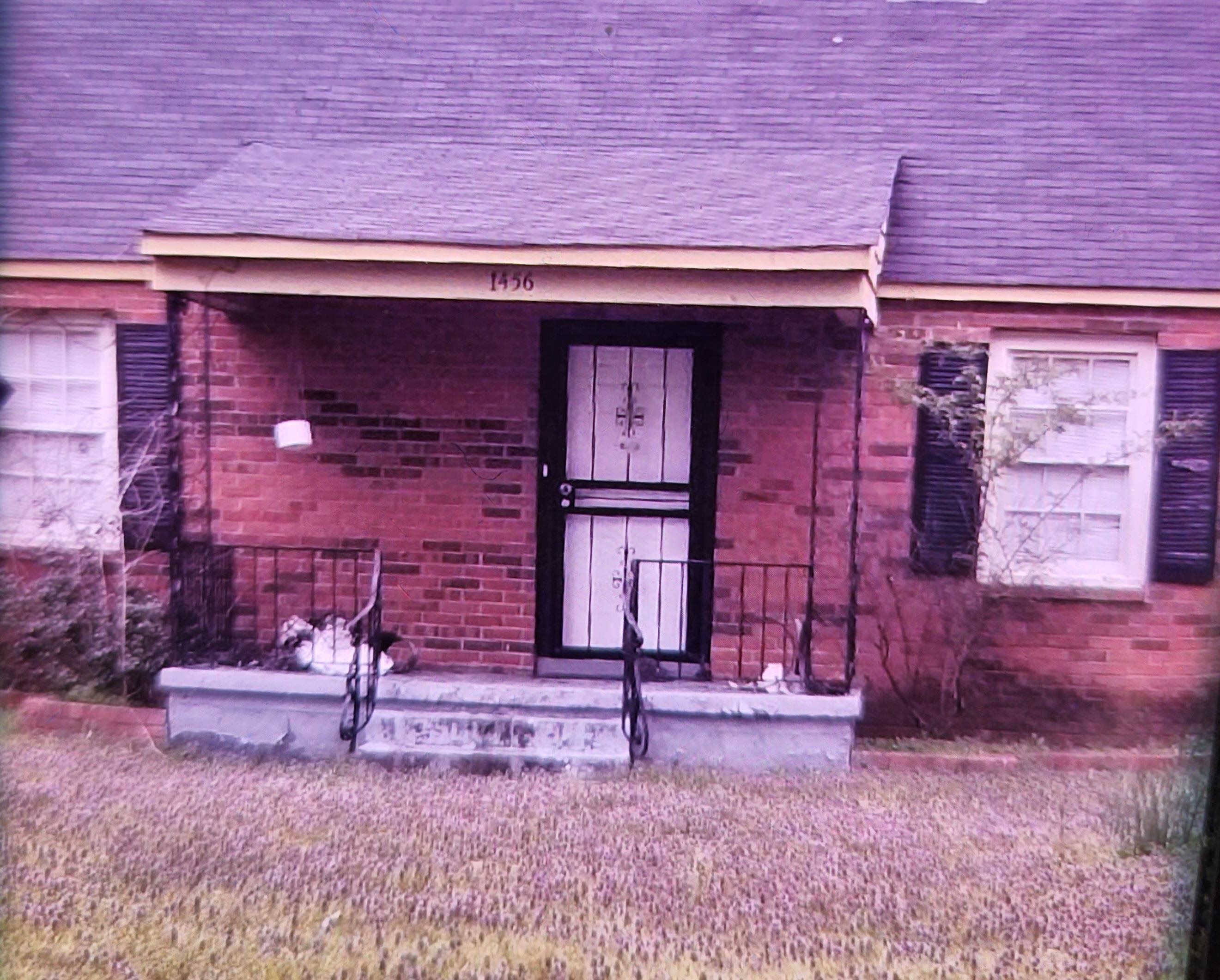 1456 Rienel Street Memphis, TN 38111 - Photo 1 of 2 a living room with a fireplace