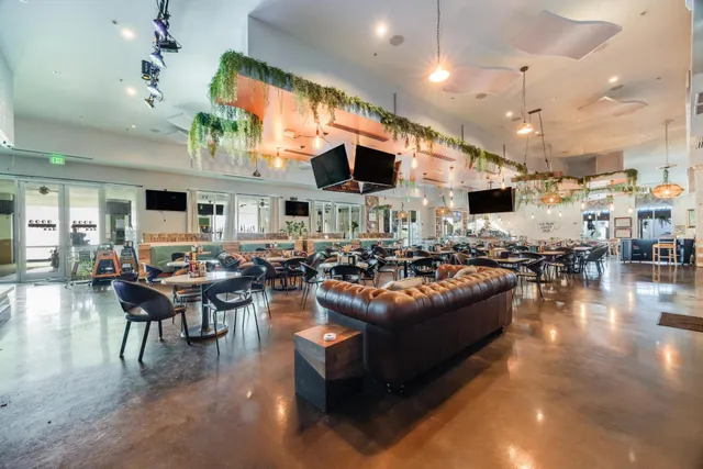 a view of a swimming pool with outdoor seating