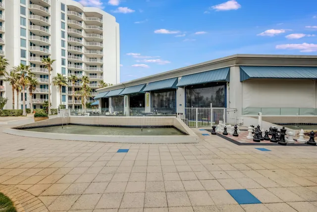 a swimming pool with outdoor seating and yard