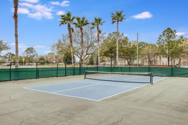 an aerial view of a residential houses with outdoor space