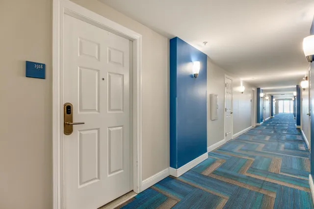 a living room with furniture kitchen view and a table
