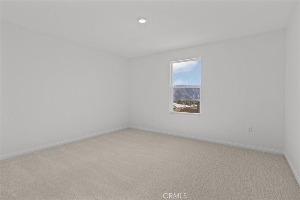 1249 Butterfly Way Banning, CA 92220 - Photo 11 of 18 an empty room with a window