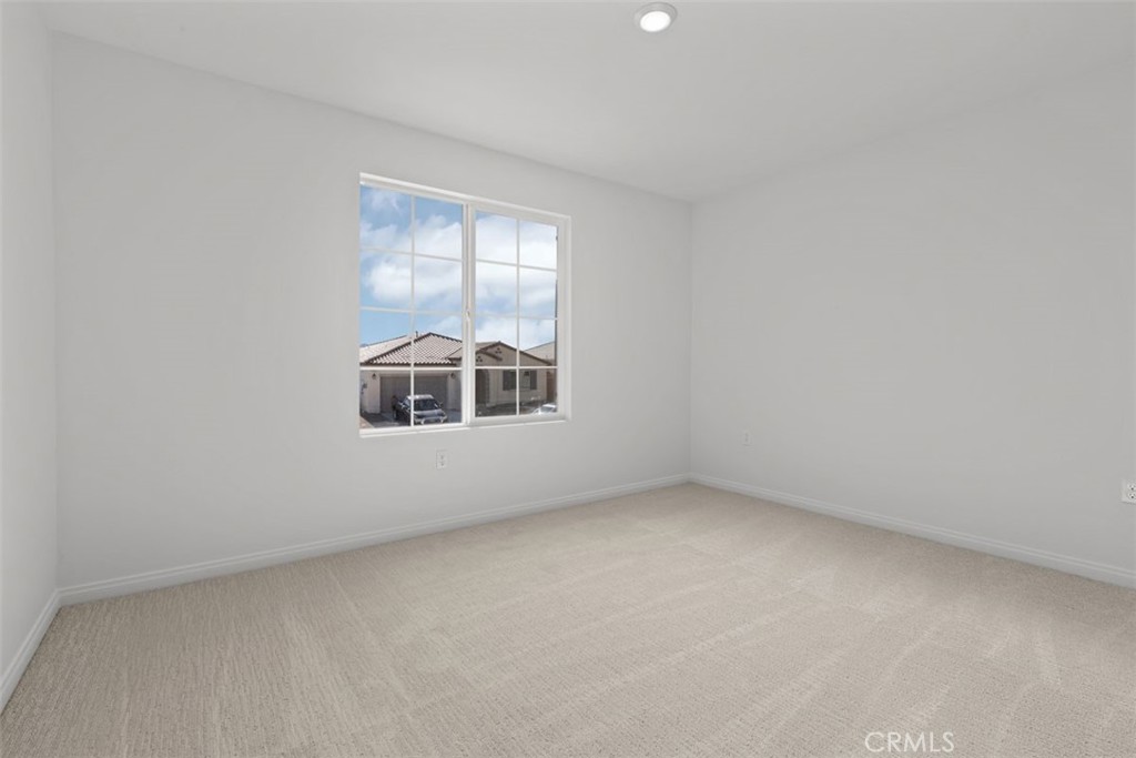 1249 Butterfly Way Banning, CA 92220 - Photo 2 of 18 an empty room with a window