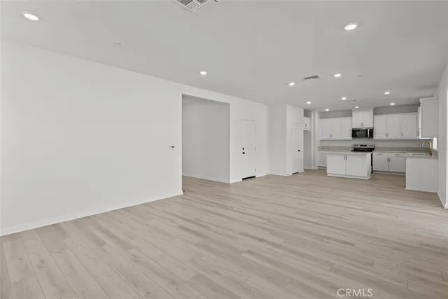a view of kitchen with wooden floor