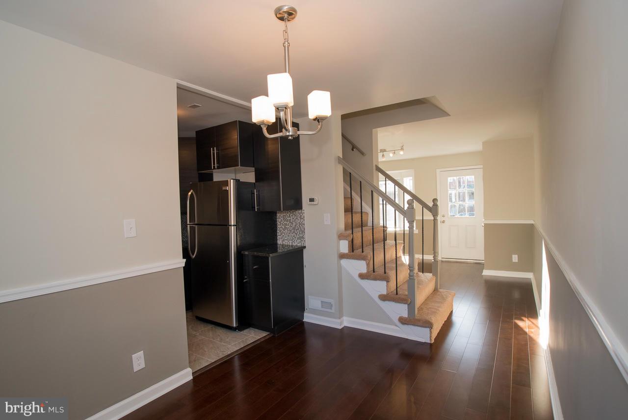 450 Torner Road Baltimore, MD 21221 - Photo 1 of 10 a view of a hallway with wooden floor and staircase