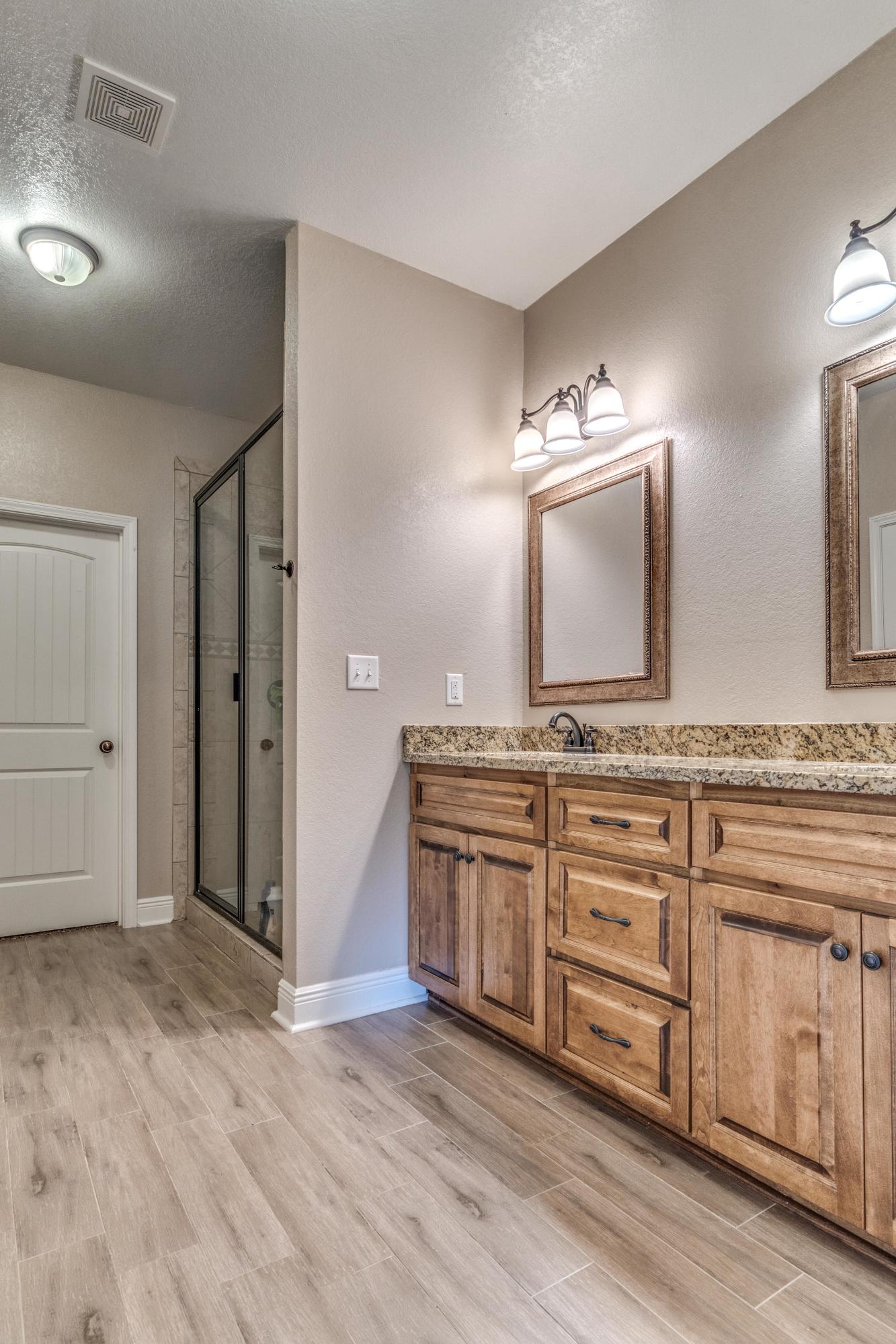 4005 Happy Trails Road Crestview, FL 32539 - Photo 14 of 24 a spacious bathroom with a double vanity sink and a mirror