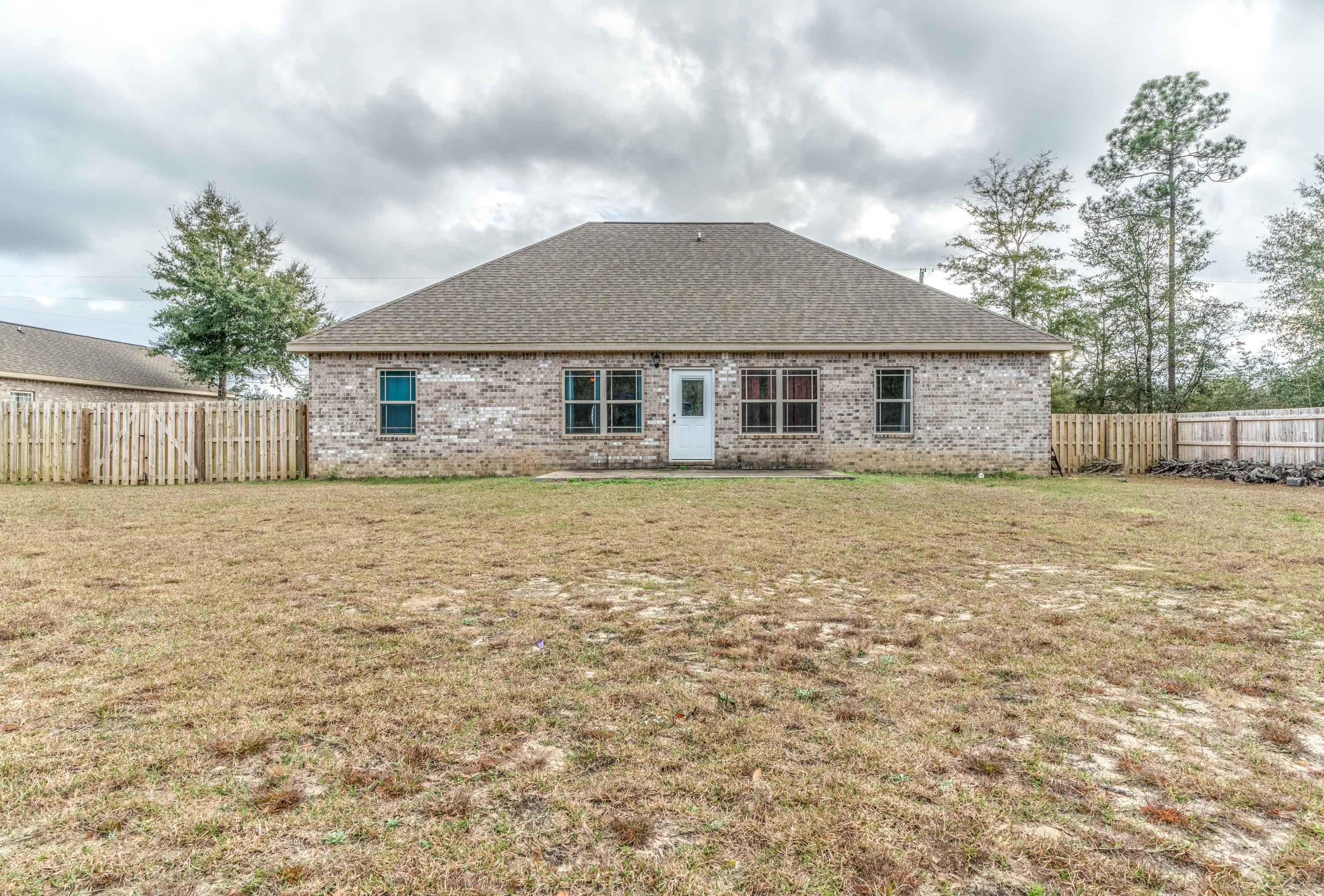 4005 Happy Trails Road Crestview, FL 32539 - Photo 21 of 24 front view of a house with a yard