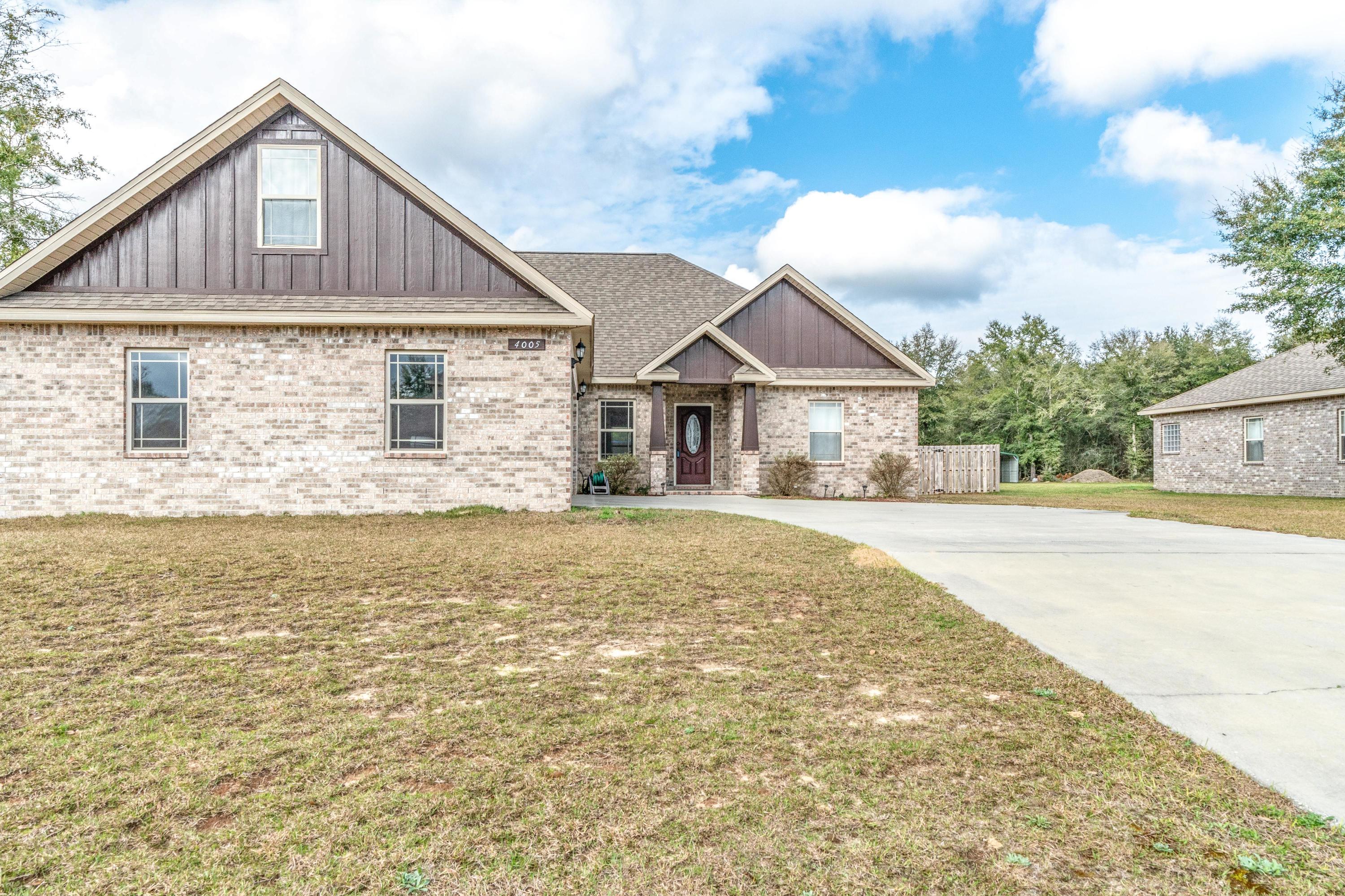 4005 Happy Trails Road Crestview, FL 32539 - Photo 23 of 24 a front view of a house with yard