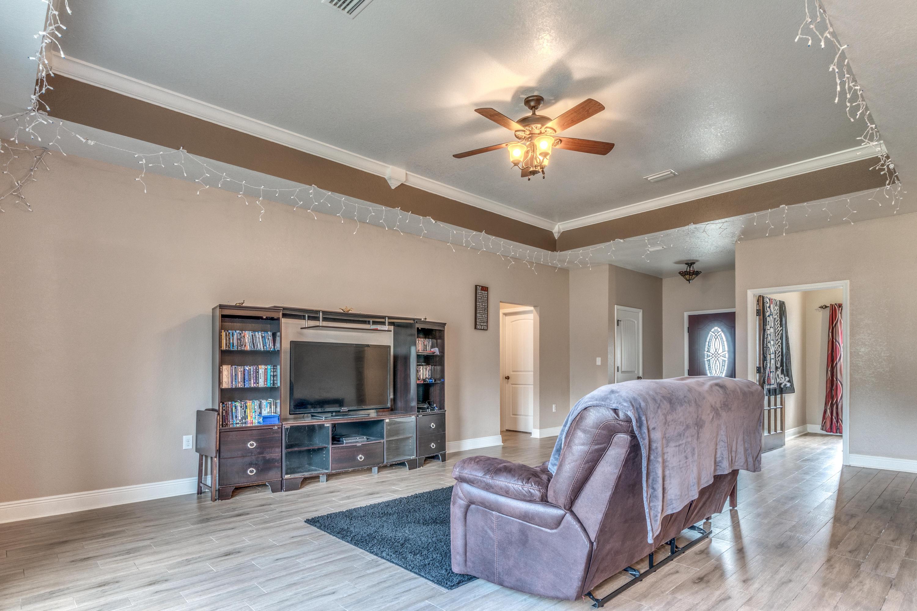 4005 Happy Trails Road Crestview, FL 32539 - Photo 4 of 24 a living room with furniture and a flat screen tv