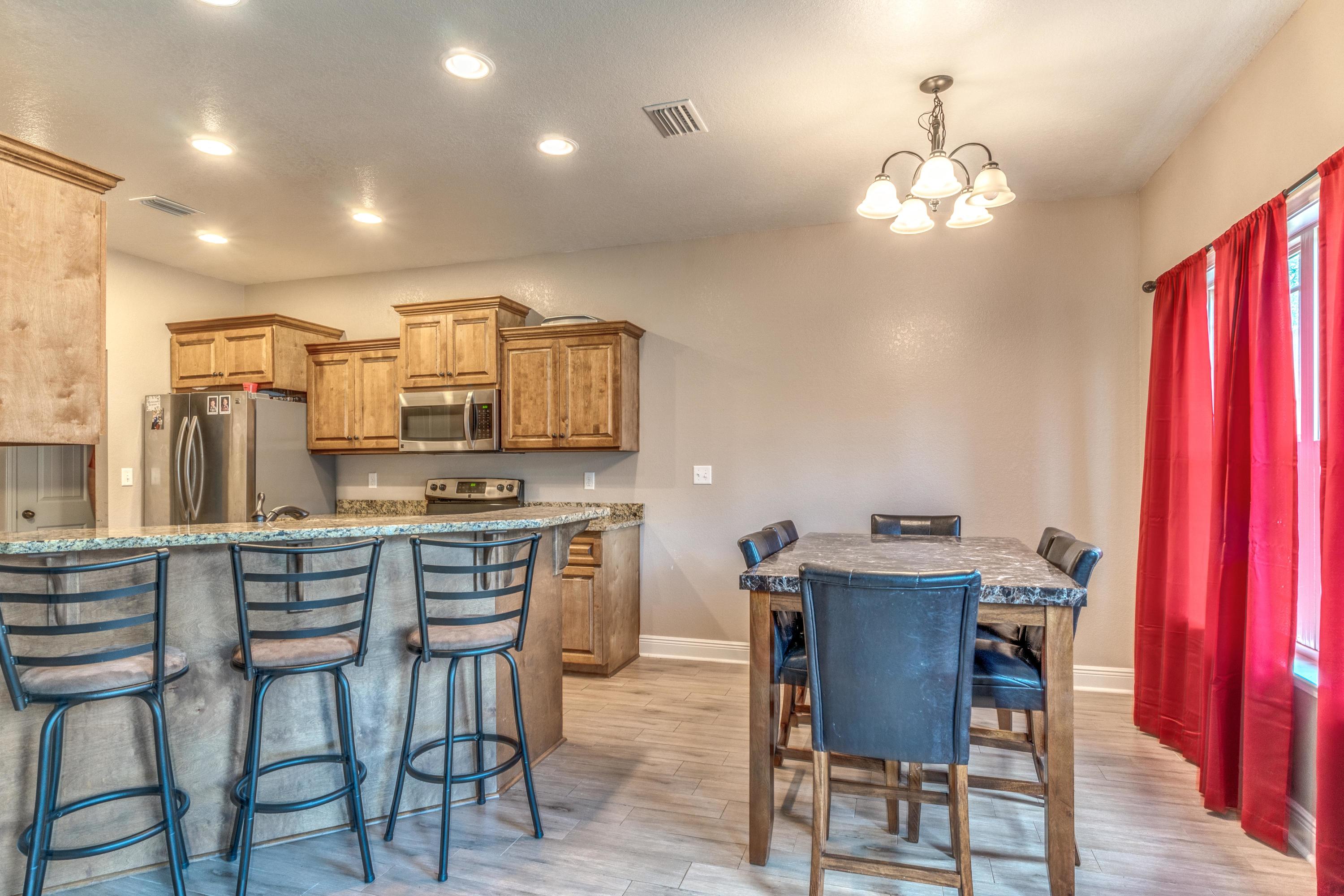 4005 Happy Trails Road Crestview, FL 32539 - Photo 9 of 24 a view of a dining room with furniture window and wooden floor