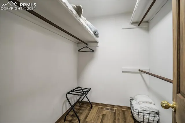 a bathroom with a shower curtain and a window