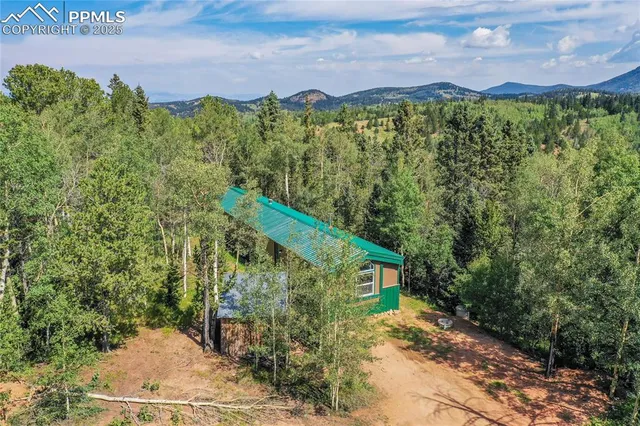 a view of a back yard from a balcony