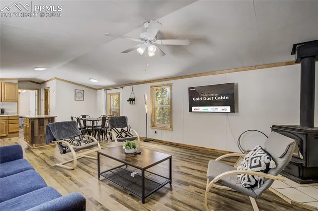 a living room with furniture a couch and wooden floor