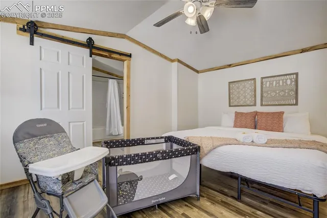 a bedroom with a bed and a chair