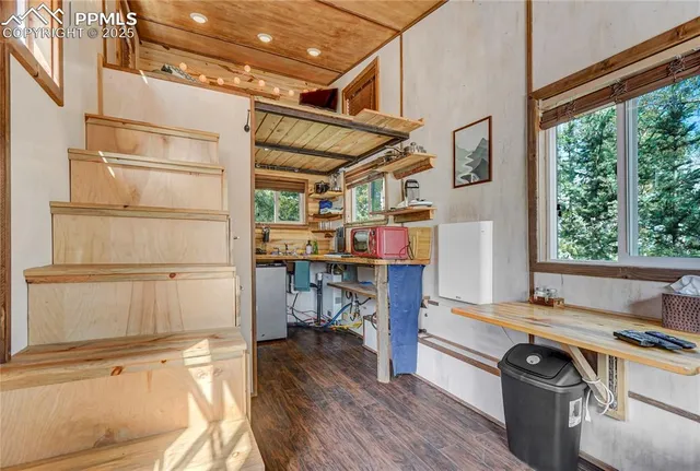 a kitchen with a stove a sink a stove and wooden cabinets