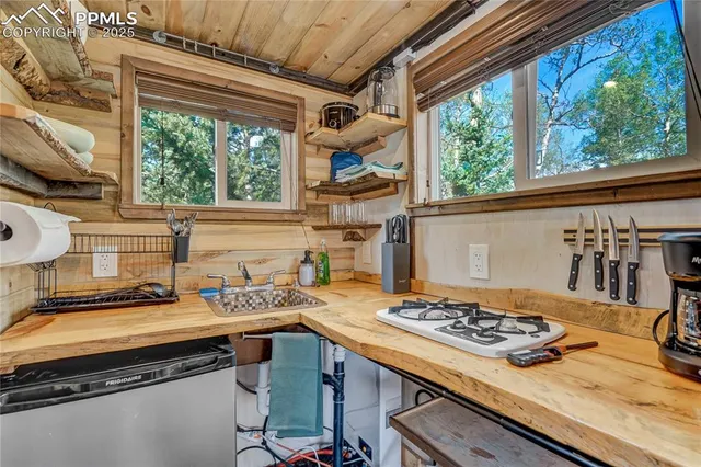 a view of a bedroom with furniture and windows