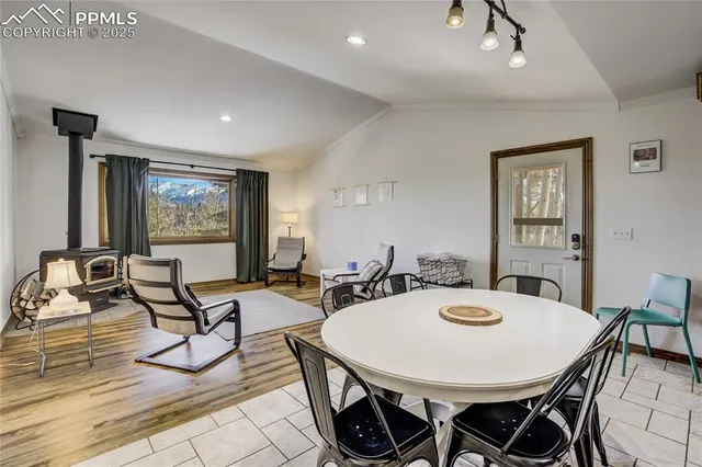 a view of a dining room with furniture window and outside view