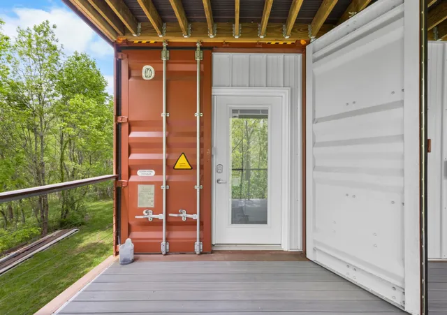 a view of outdoor space with wooden floor