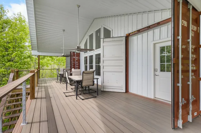 a kitchen with granite countertop white cabinets and a stove