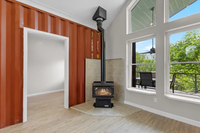 a view of walk in closet with wooden floor
