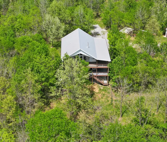 an aerial view of houses with yard
